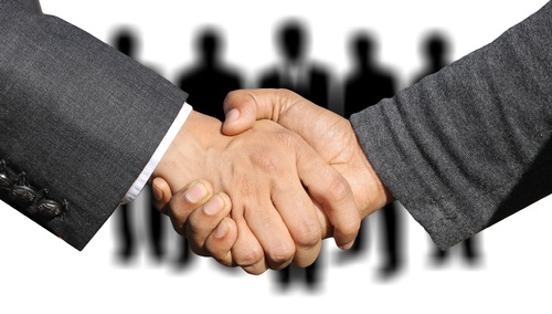 Uścisk dłoni. Ilustracja poglądowa