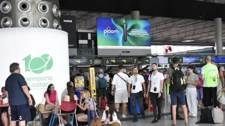 Travelers at Fontanarossa Airport in Catania