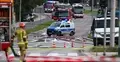 Awaria instalacji gazowej w Gdańsku, na zdjęciu strażak, ulica i radiowóz policji